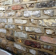 New brick wall - constructed out of old London yellow bricks.
