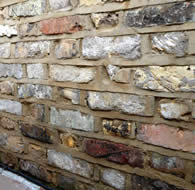 New brick wall - constructed out of old London yellow bricks.